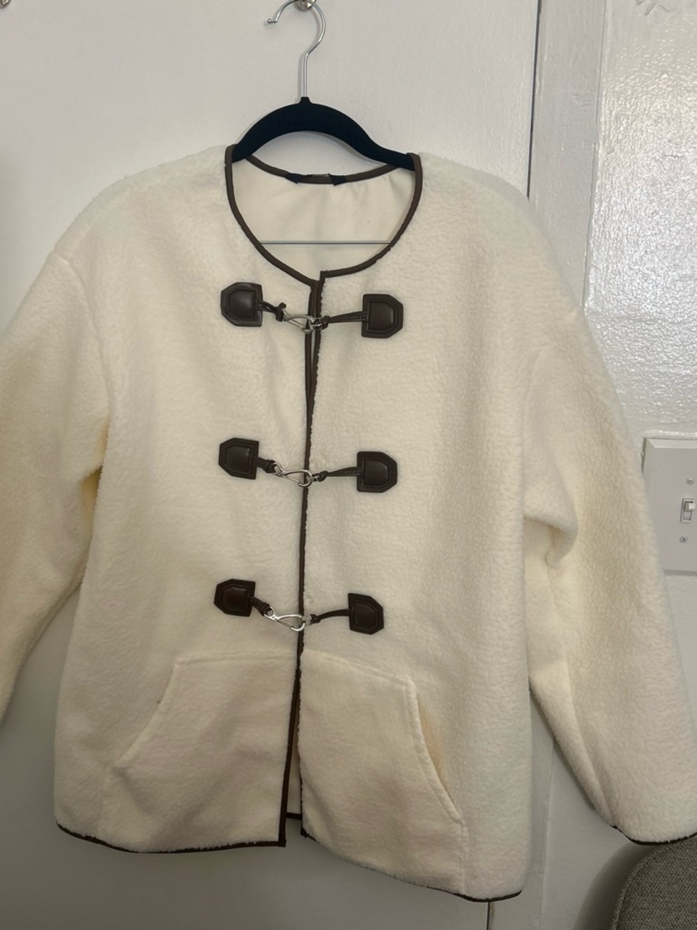 Cream Sherpa Puffer Jacket with Brown Trim and Toggle Closures